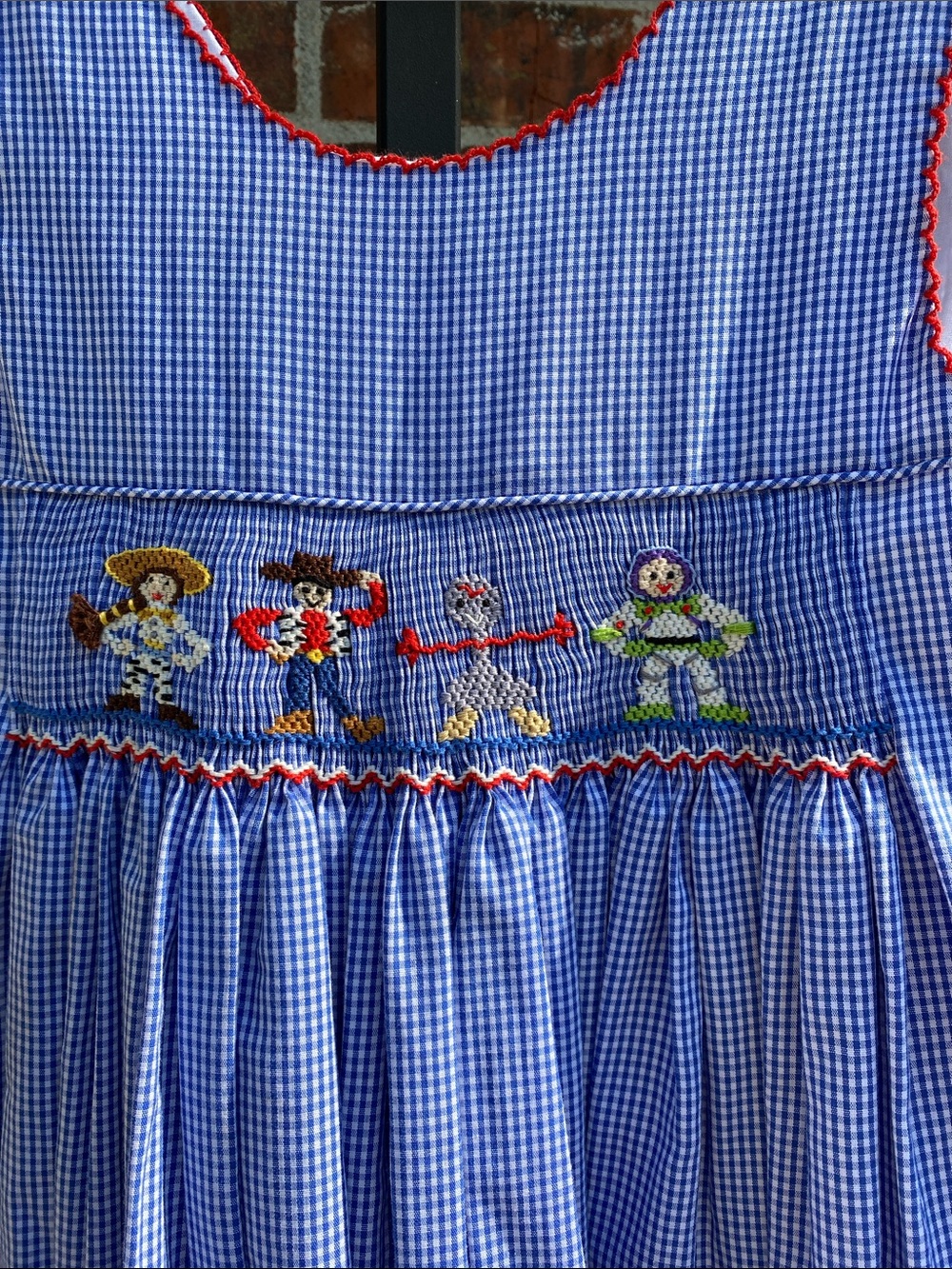 Size 5 Anavini hand smocked Toy Story Dress Blue